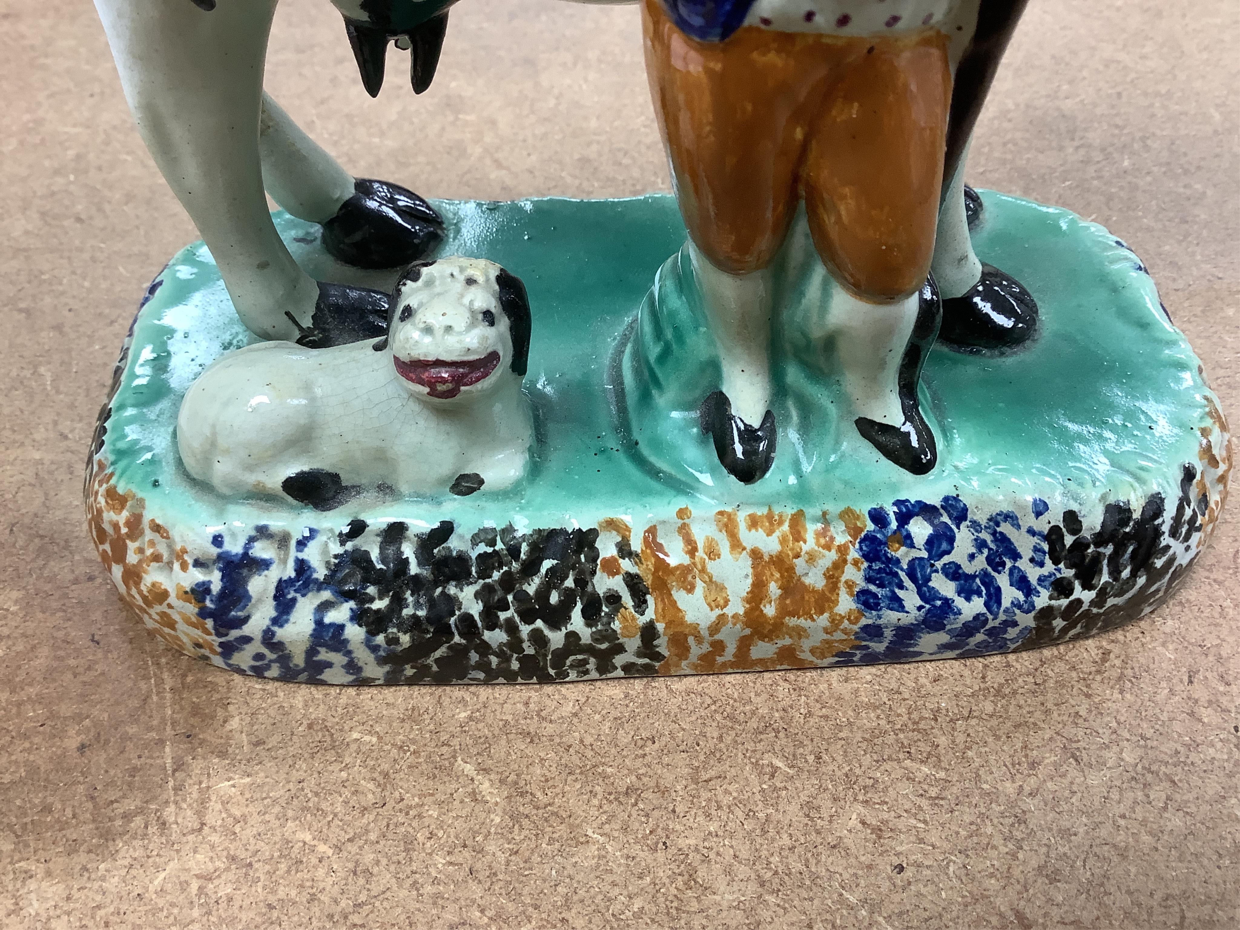 Two Yorkshire Prattware cows, with farmer or milkmaid and dog groups, c.1810